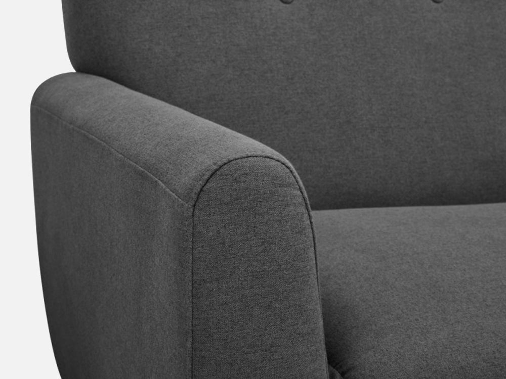 Close-up of the dark grey fabric and armrest of the MUNICH 3-Seater Sofa Bed, showcasing its contemporary design.