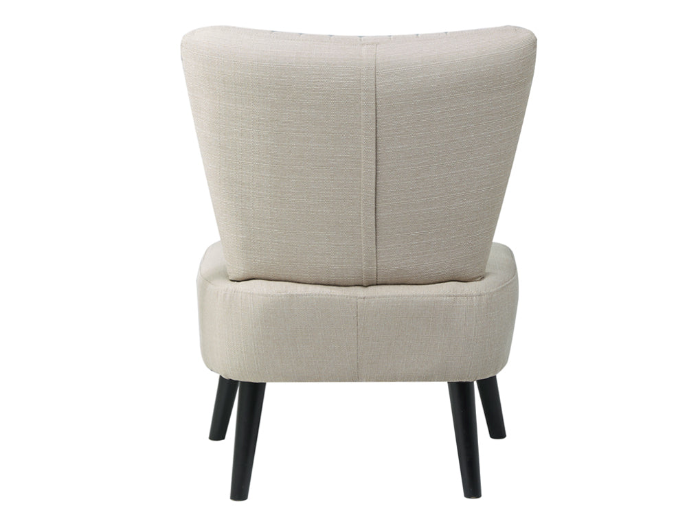 Back view of the Anita Occasional Chair by BetaLife, showcasing its elegant fabric design and sturdy black legs.
