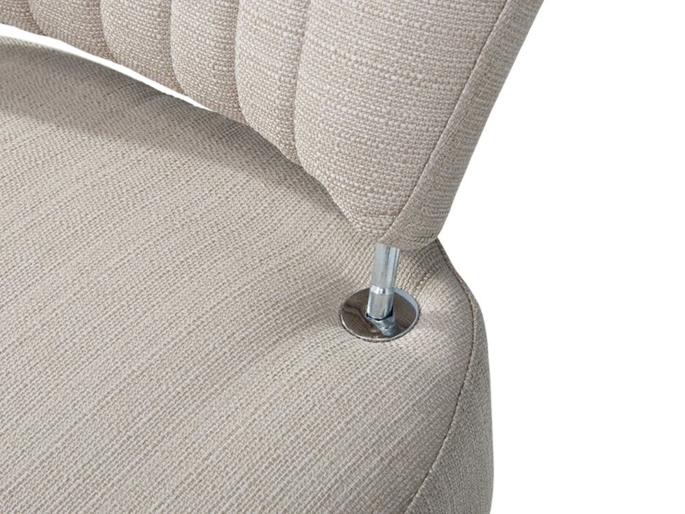 Close-up of Anita Occasional Chair, showcasing its elegant fabric and chrome detail for a stylish lounge experience.