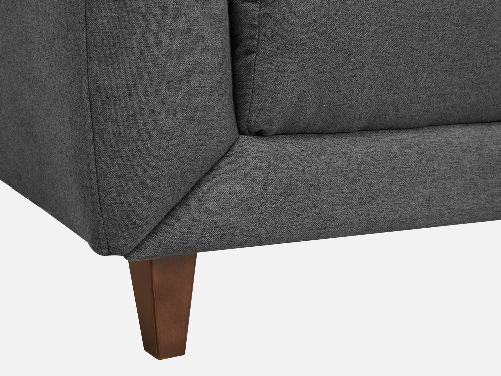 Close-up of the MUNICH 3-Seater Sofa Bed in dark grey, showcasing its contemporary design and wooden legs.