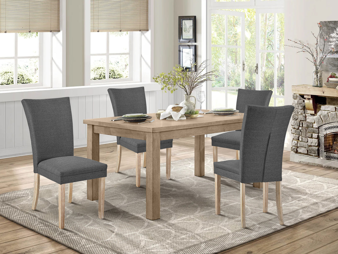 Grace 4 piece upholstered dining chairs in dark grey around a wooden dining table in a cozy setting.