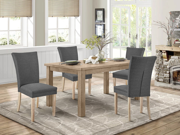 Grace 4 piece upholstered dining chairs in dark grey around a wooden dining table in a cozy setting.