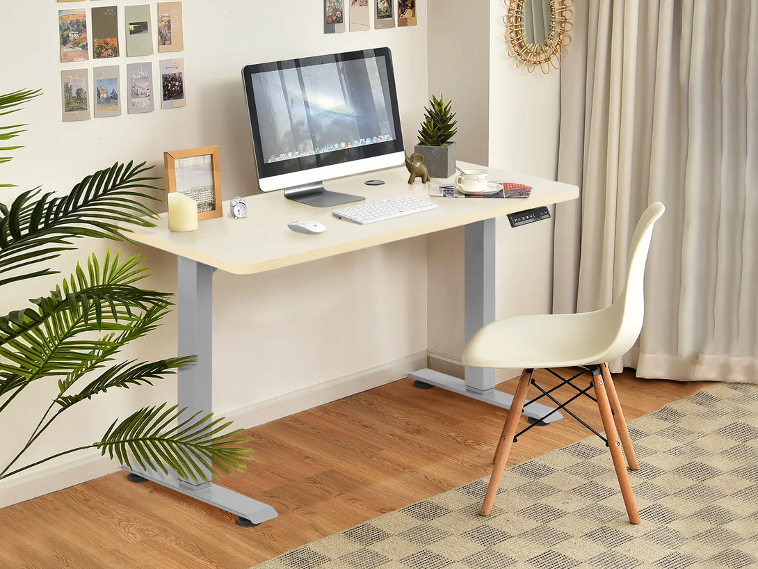 Bennie 140CM Dual Motor Electric Standing Desk in beige, featuring a sleek design and computer setup in a modern workspace.