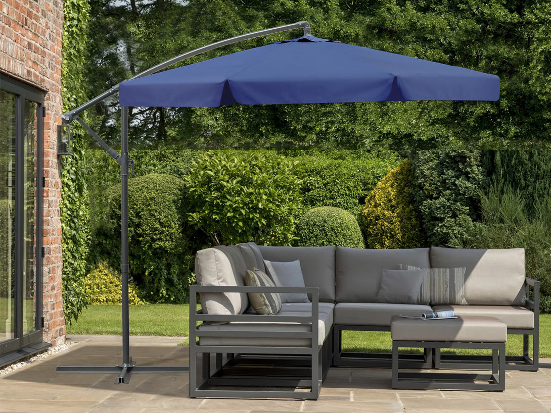 Toughout Puriri 3m outdoor cantilever umbrella in navy over a modern patio seating area.