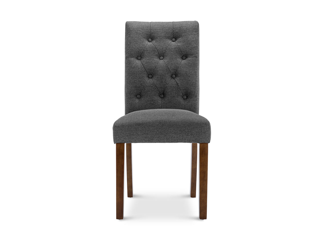 Lucia 4 Piece Upholstered Dining Chair in Dark Grey with button tufted backrest and wooden legs.
