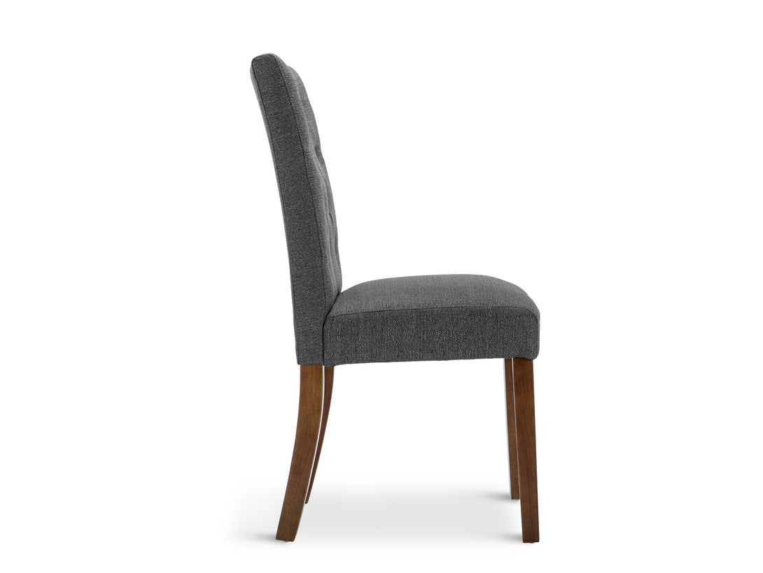 Lucia 4 Piece Upholstered Dining Chair in Dark Grey showcasing side view with button tufted backrest and wooden legs.