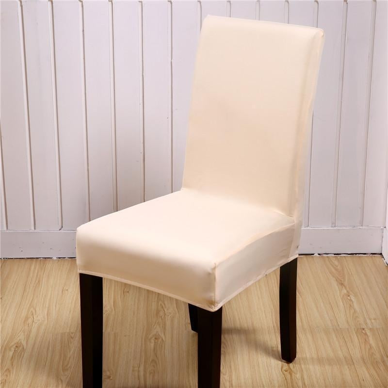 Beige stretch elastic dining chair cover on a wooden chair, perfect for style and protection against dust.