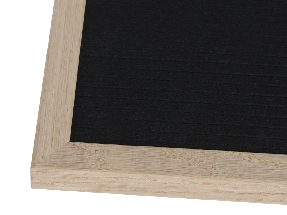 Close-up of a retro changeable DIY felt letter board with a wooden frame, ideal for quotes and photo props.