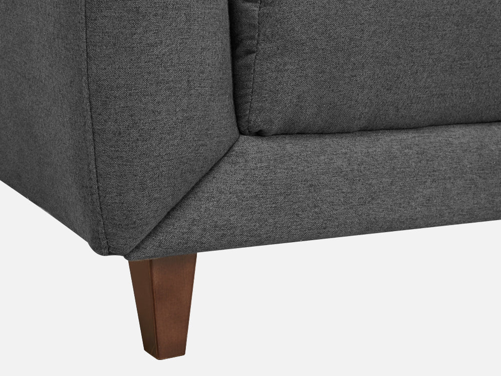 Close-up of the MUNICH 3-Seater Sofa Bed's dark grey fabric and wooden legs, showcasing its modern design.